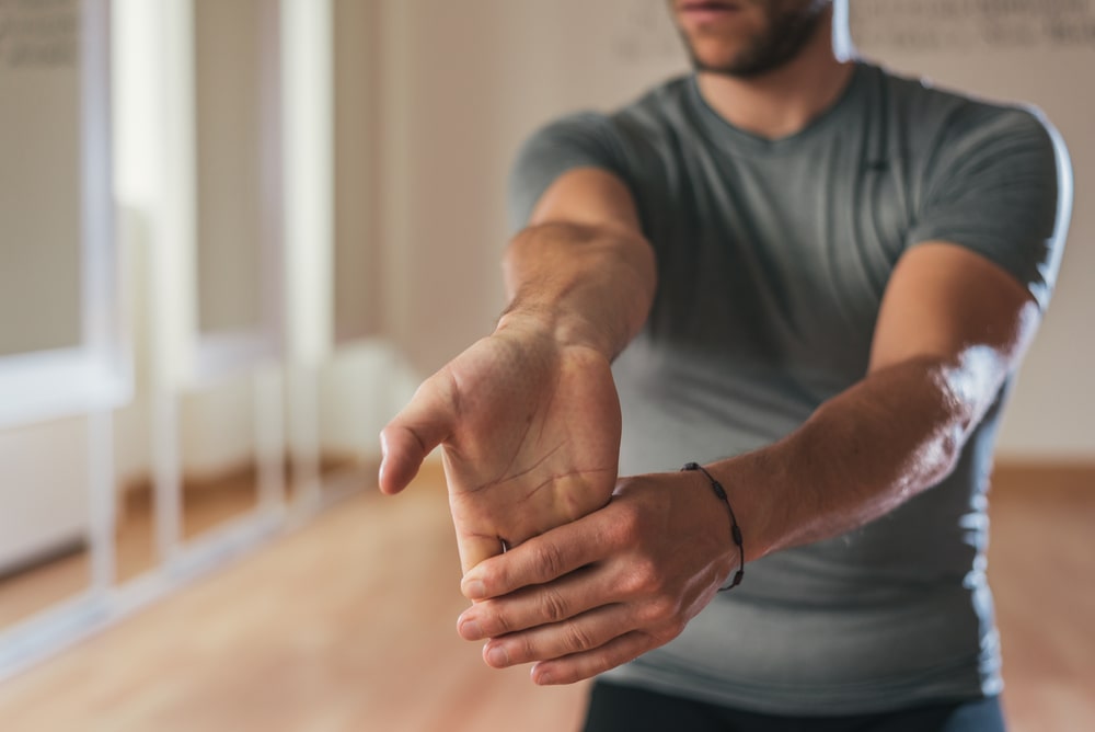 Man stretching his hand